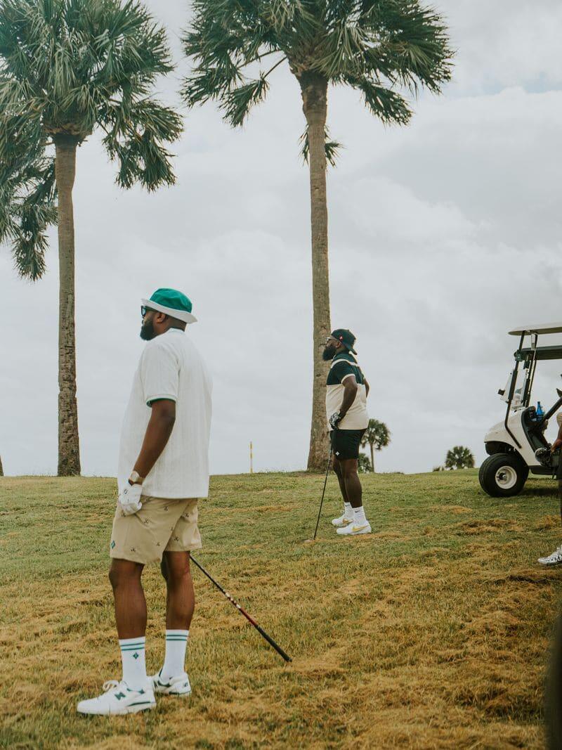 Golfers under the palms in Palm Beach
